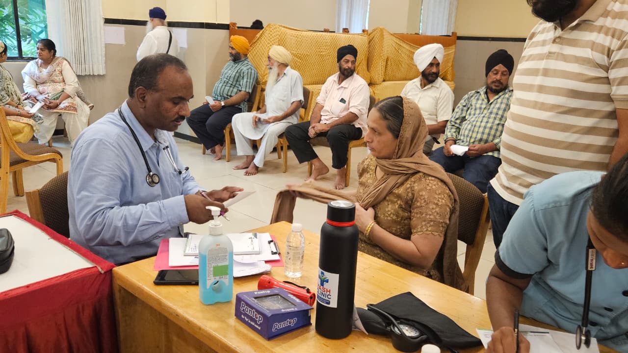 Doctor speaking with an attendee at the Health Checkup Camp in Vapi